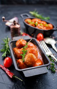 meatballs with tomato sauce in metal bowl
