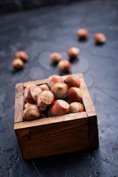 huzelnuts in wooden box on a table
