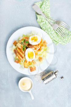 salad with fried chicken and boiled eggs