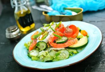 fresh salad with raw salmon avocado vegetables