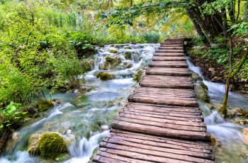 Wooden pathway above water at Plitvice National Park. UNESCO world heritage in Croatia