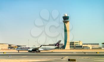 Doha, Qatar - July 15, 2019: Airbus A350-941 of Qatar Airways at Hamad International Airport. The airport opened on 30 April 2014 and now accomodates over 35 million passengers per year