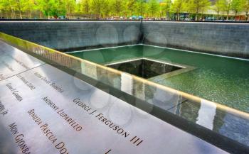 New York City, United States - May 5, 2017: National September 11 Memorial commemorating the terrorist attacks on the World Trade Center
