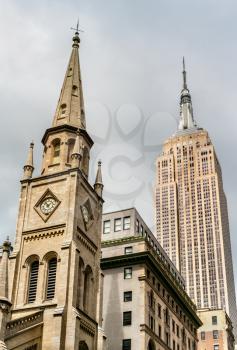New York City, United States - May 6, 2017: Marble Collegiate Church and Empire State Building in Manhattan