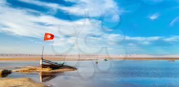 Boat on Chott el Djerid, an endorheic salt lake in Tunisia