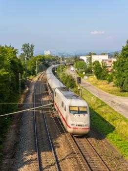 OFFENBURG, GERMANY - JULY 10: Intercity Express train of Deutsche Bahn on JULY 10, 2013 in Offenburg, Germany. DB AG carries about two billion passengers each year.