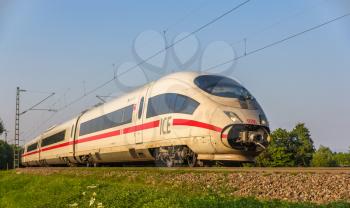 OFFENBURG, GERMANY - JULY 10: Intercity Express train of Deutsche Bahn on JULY 10, 2013 in Offenburg, Germany. DB AG carries about two billion passengers each year.