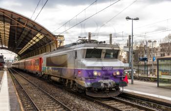 AVIGNON, FRANCE - JANUARY 02: Regional train hauled by an electric locomotive at Avignon station on January 2, 2014. SNCF operates 198 locomotive of the class BB 7200