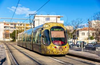 MONTPELLIER, FRANCE - JANUARY 05: Alstom Citadis 302 tram on January 5, 2014 in Montpellier, France. The Montpellier tramway system has 4 lines and 84 stations