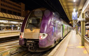 LYON, FRANCE - JANUARY 07: SNCF double-decker regional train on January 7, 2014 at Lyon Part-Dieu railway station. The station was constructed in 1978 as part of the new Part-Dieu urban neighborhood project