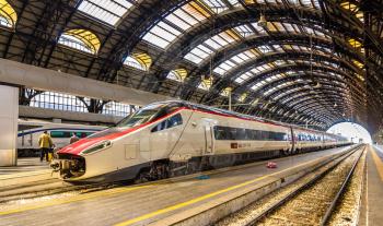Milan, Italy - May 8, 2014: New Pendolino high-speed tilting train at Milano Centrale railway station. This train is owned by SBB CFF FFS - Swiss Federal Railways