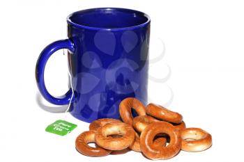 Blue cup of tea and bagels isolated on white background