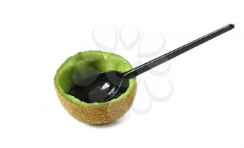 Half eaten kiwi and plastic spoon isolated on white background