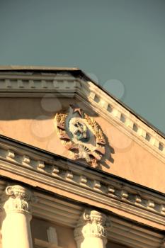 Emblem of USSR on the building. Part of the roof