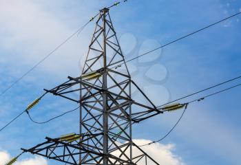 Electricity transmission pylon against blue sky. High voltage pylon.