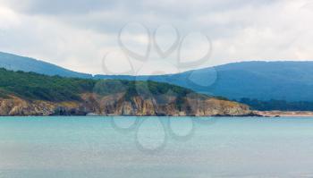 Black Sea Coast. Beautiful seascape with rocks, mountains and sea. Rocky shore wooded mountains and the sea.