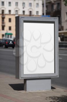Blank vertical billboard. Clipping path. Shallow depth of field.