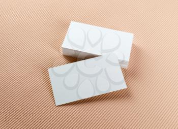 Stack of blank business cards on a colored background. Template for ID.
