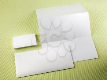 Blank stationery set on a green background. Template for branding identity.