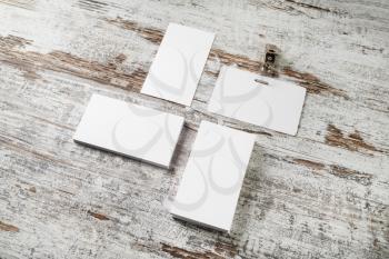 Bank business cards and badge on vintage wood table background. Photo of blank stationery. Responsive design template.