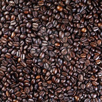 Brown coffee beans background. Coffee beans texture. Top view