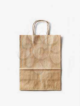 Blank craft paper bag on white paper background. Recyclable package. Template ready for your design.