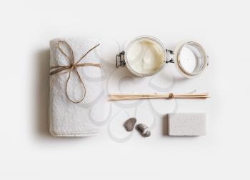 Spa treatment and beauty products on white paper background. Flat lay.