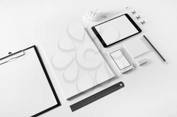 Blank corporate stationery and gadgets set on white paper background. Business brand template.