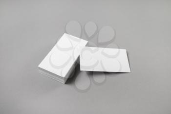 Blank business cards on gray paper background. Mockup for branding identity for designers.