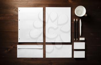 Blank corporate stationery on wood table background. Branding mock up. Flat lay.