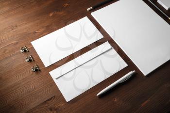 Blank stationery set on black paper background. Corporate identity mockup. Responsive design template.