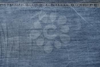 Old jeans background. Denim texture for design.