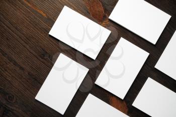 Blank white business cards mock-up on wooden background.Copy space for text. Flat lay.