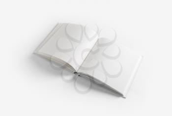 Photo of opened book with blank white pages on white paper background.