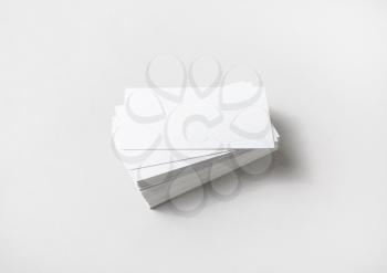 Photo of blank business cards stack on paper background. Studio shot.