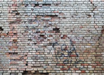 Brick wall texture. Old brickwork background with damaged surface.