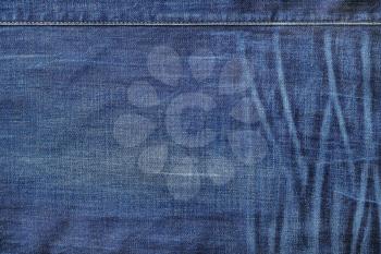 Blue denim texture. Jeans background with stitch.