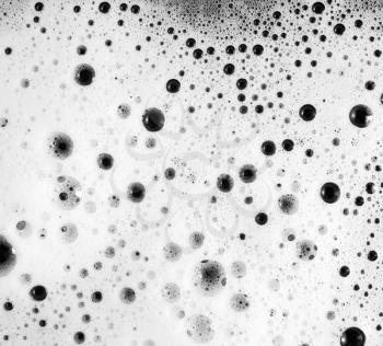 Foam with bubbles. Soap sud. Abstract background. Shampoo in water. Flat lay