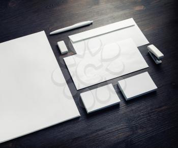 Blank branding template on vintage wooden table background. Photo of blank stationery. Mock-up for design portfolios.