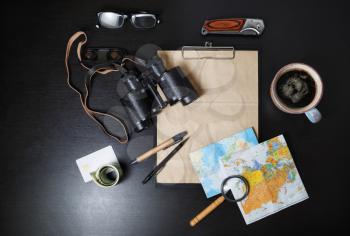 Travel plan background. Ready for the trip. Essential travel accessories on black table background. Flat lay.