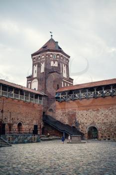 Mir, Belarus - August 04, 2017: Ancient medieval castle with tower in Mir, Belarus. UNESCO world heritage site. Vertical shot.