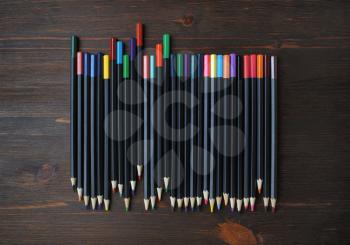 Color pencils on wood table background. Beautiful color pencils. Flat lay.