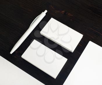 Blank business cards and pen. Business brand template on wood table background. White stationery set.