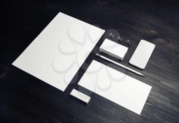 Blank branding identity set on wood table background. Corporate stationery template. For design presentations and portfolios.