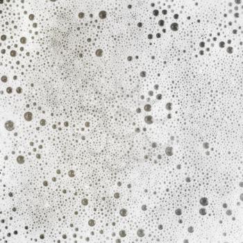 Foam with bubbles. Soap sud. Detergent in water. Abstract soapy texture. Flat lay.