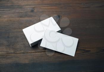 Blank business cards on wood table background. Mockup for branding identity. Template for graphic designers portfolios.