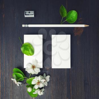 Blank stationery and flowers. Blank business cards, pencil and sharpener. Top view. Flat lay.