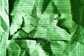 Horizontal green crumpled punched cards composition