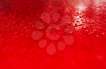 Red water drops after rain bokeh background