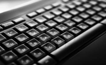 Horizontal black and white russian english computer keyboard bokeh background backdrop